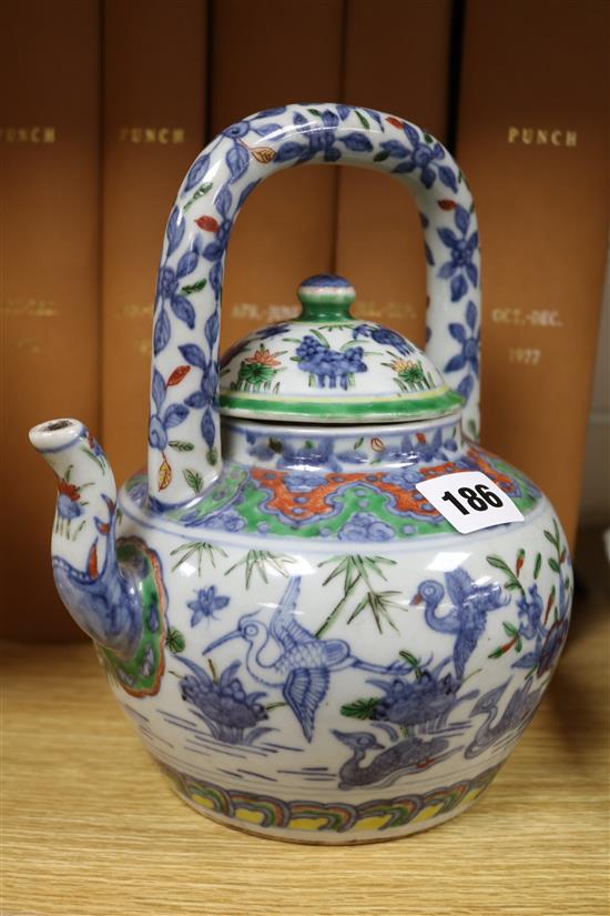 Two Chinese teapots and a cup and saucer Tallest teapot 23cm